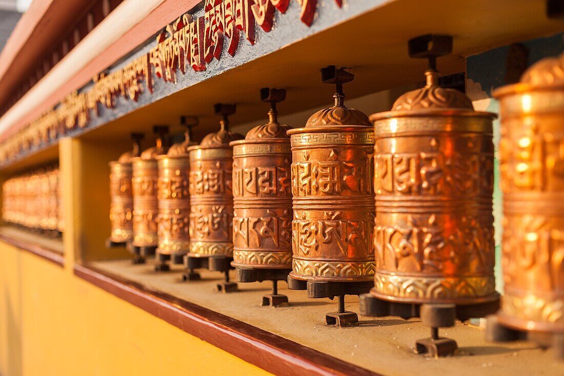 Tibetan copper prayer wheels at a monastery in Pokhara, Nepal.
