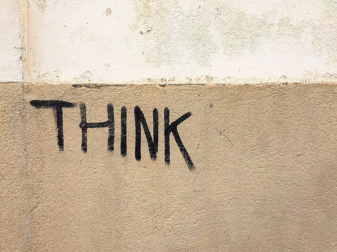 Think text on building wall