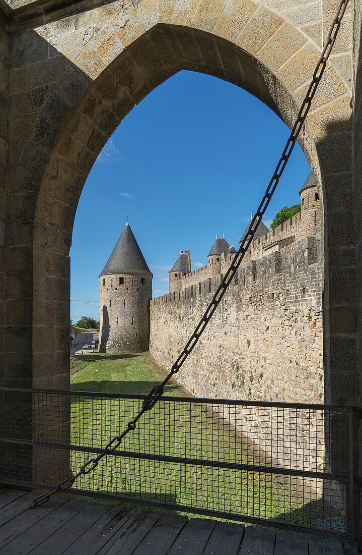 Arch behind gate at castle in Carcassonne, Languedoc-Roussillon, France