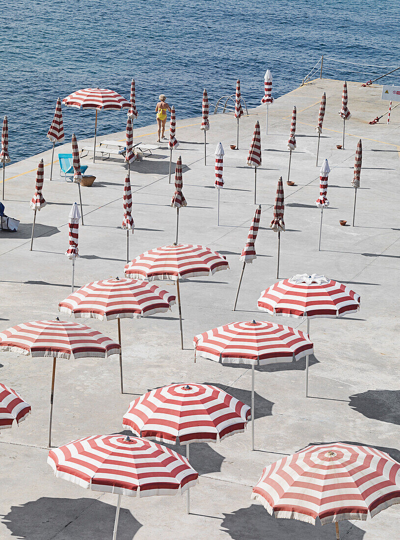 High angle view of striped parasols at beach
