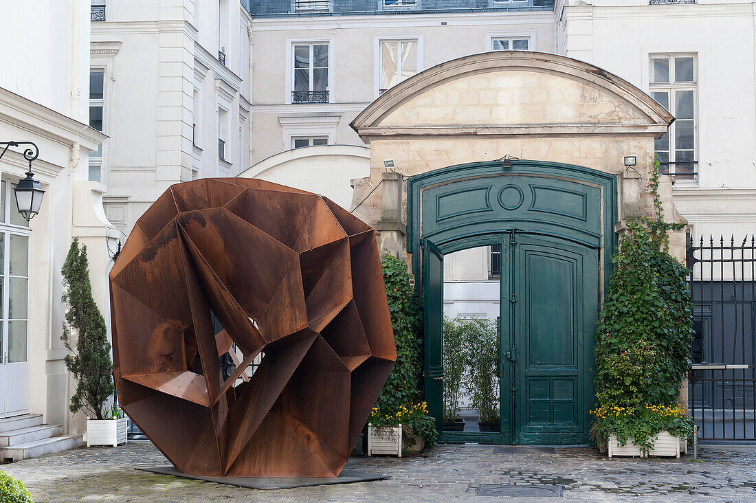 Europe, France, Paris (75), 3rd arrondissement, Le Marais, rue Charlot, the Retz hotel courtyard, Stainless steal sculpture called 'Crater Corten', designed by Arik Levy