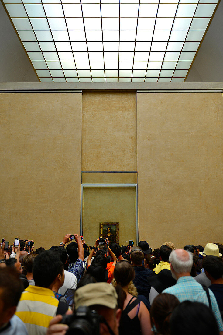 France, Paris, visitors photographing Mona Lisa at the Louvre Museum