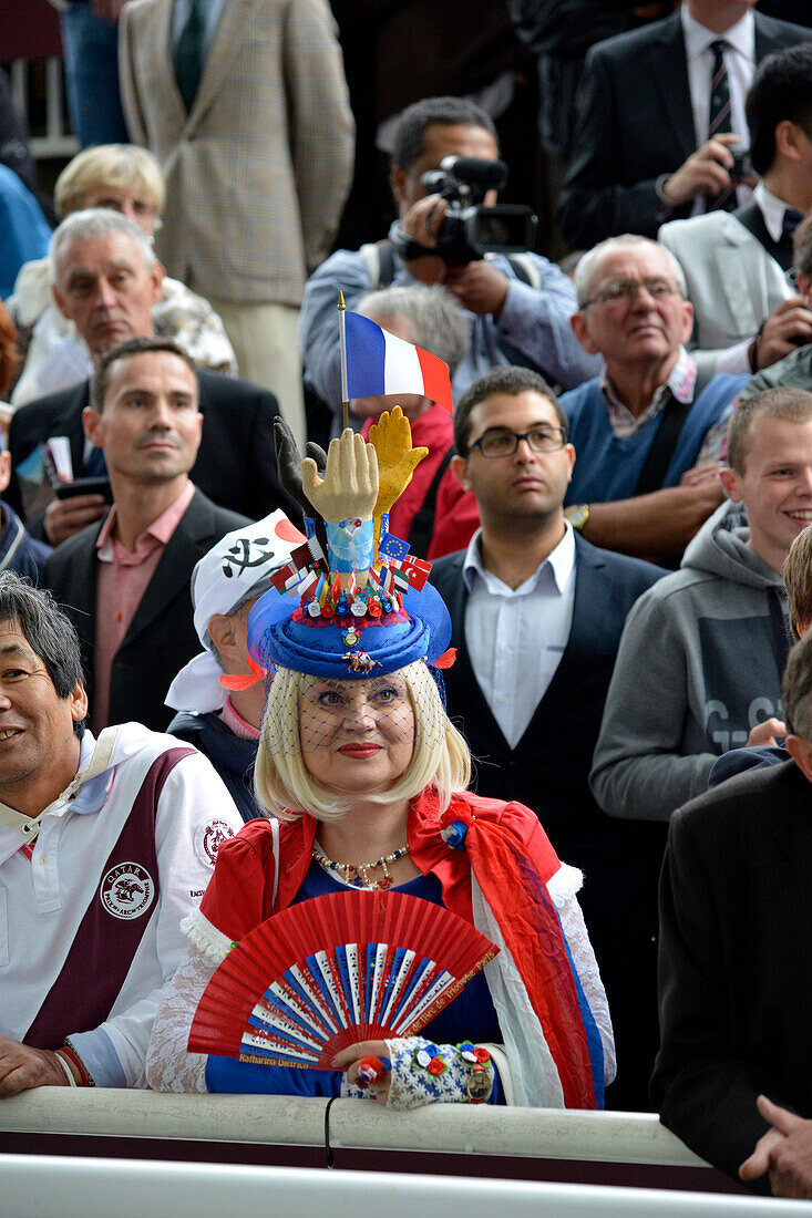 France, Paris 16th district, Longchamp Racecourse, Qatar Prix de l'Arc de Triomphe on October 5th 2014, woman in a tribune wearing a hat