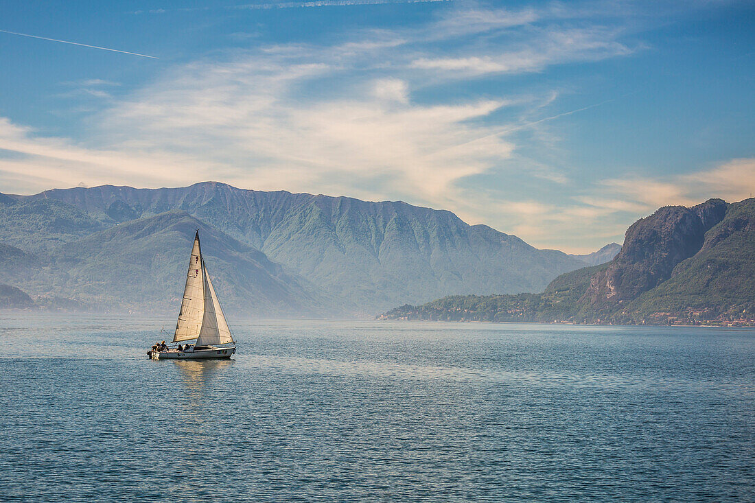 Sail boat on the waters of Lake Como, Lombardy, Italy