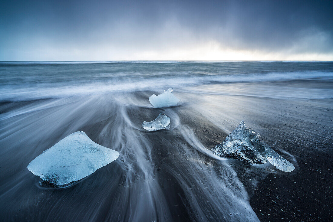 Ice blocks on the black sand beach in Jokulsarlon Glacier Lagoon, Eastern Iceland, Europe