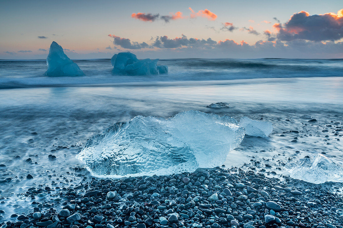 Block of ice on the black beach in Jokulsarlon Glacier Lagoon, Eastern Iceland, Europe