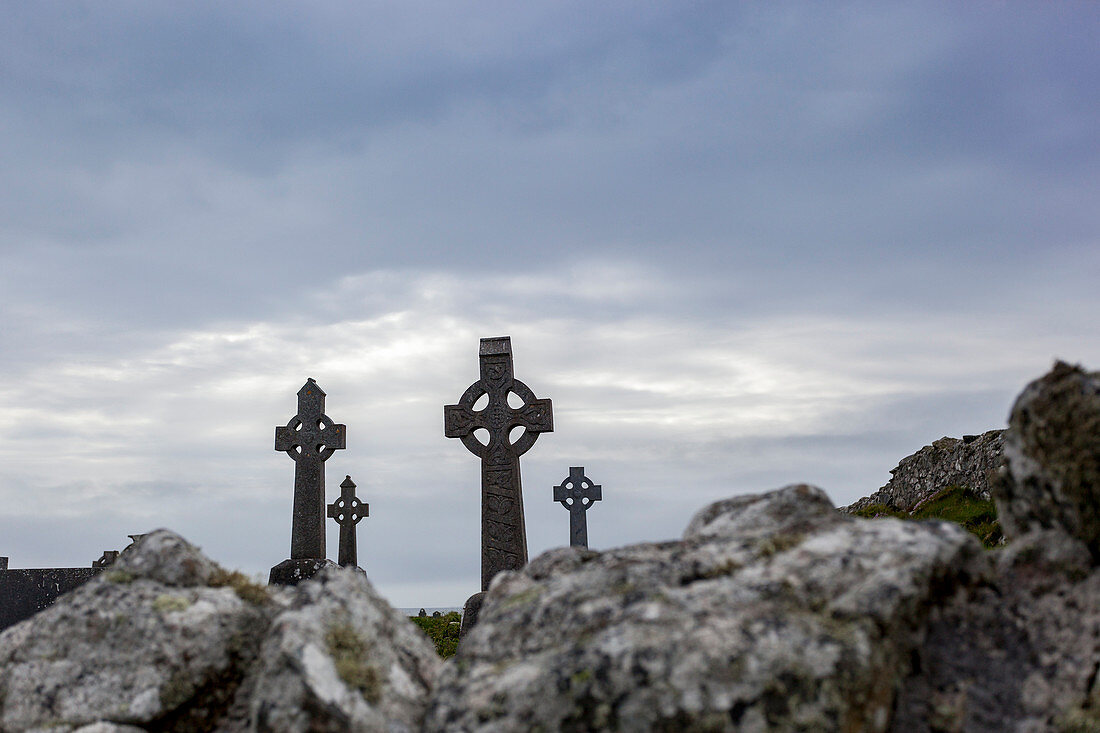 Celtic crosses in an abandoned graveyard in the County of Galway, Ireland, Europe