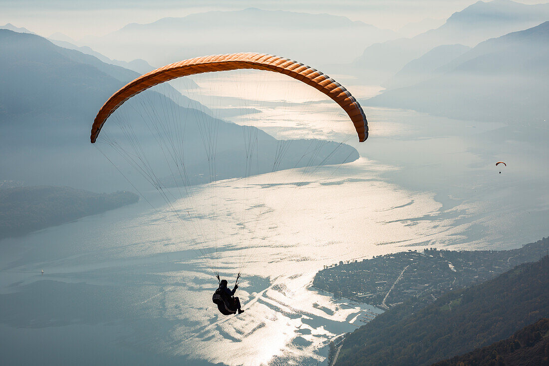 Paragliding over Lake Como and the surroundings mountains, Alto Lario, Como, Lombardy, Italy, Europe