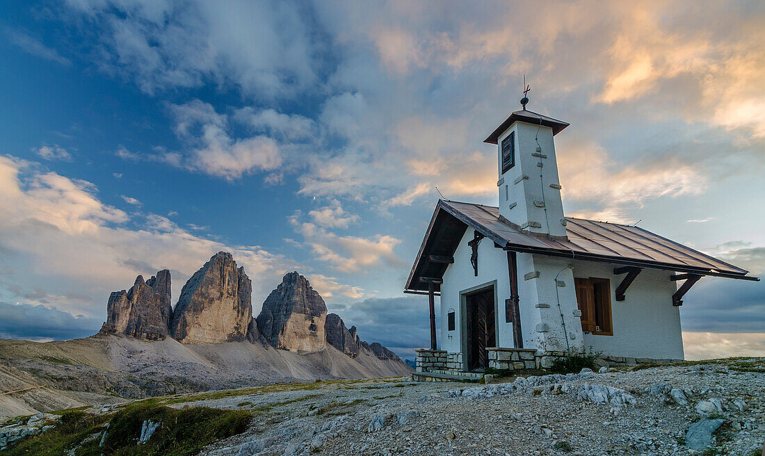 Tre Cime di Lavaredo, Three peaks of lavaredo, Drei Zinnen, Dolomites, South Tyrol, Veneto, Italy, Church and Tre Cime di Lavaredo at sunset