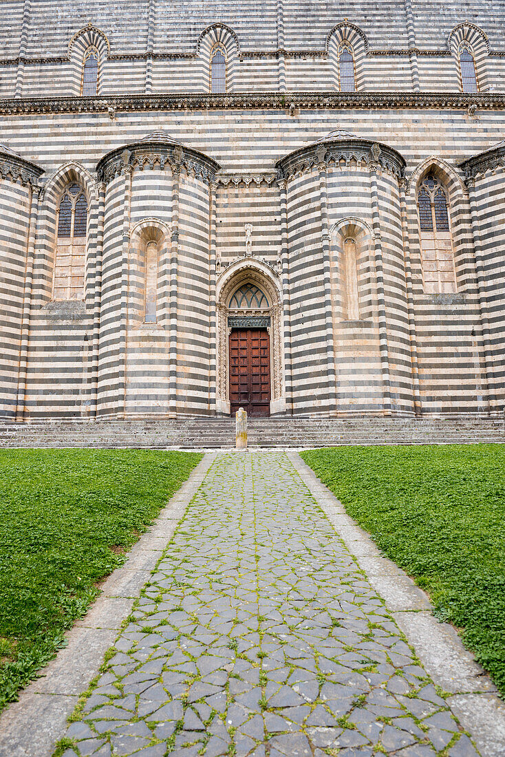Orvieto, Terni, Umbria, Italy, The unique black and white strips on the sides of the Orvieto's cathedral of Saint Mary of the Assumptio