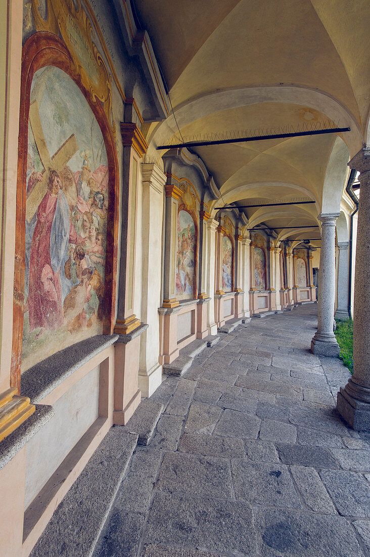 Mergozzo, lake Mergozzo, Piedmont, Italy, Church and its old cloister with paintings and arcades