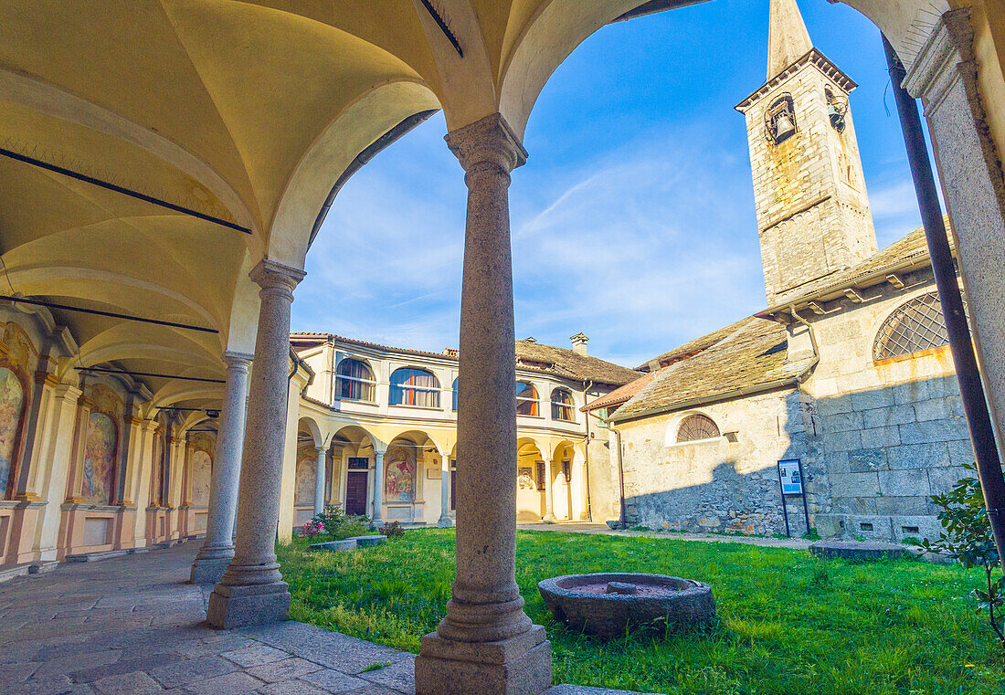 Mergozzo, lake Mergozzo, Piedmont, Italy, Church and its old cloister with paintings and arcades