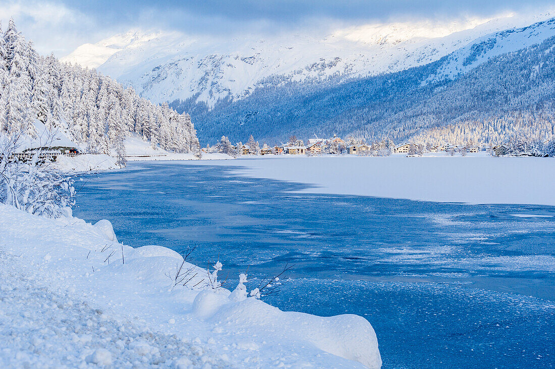 Frozen alpine lake in winter, Engadine, Switzerland