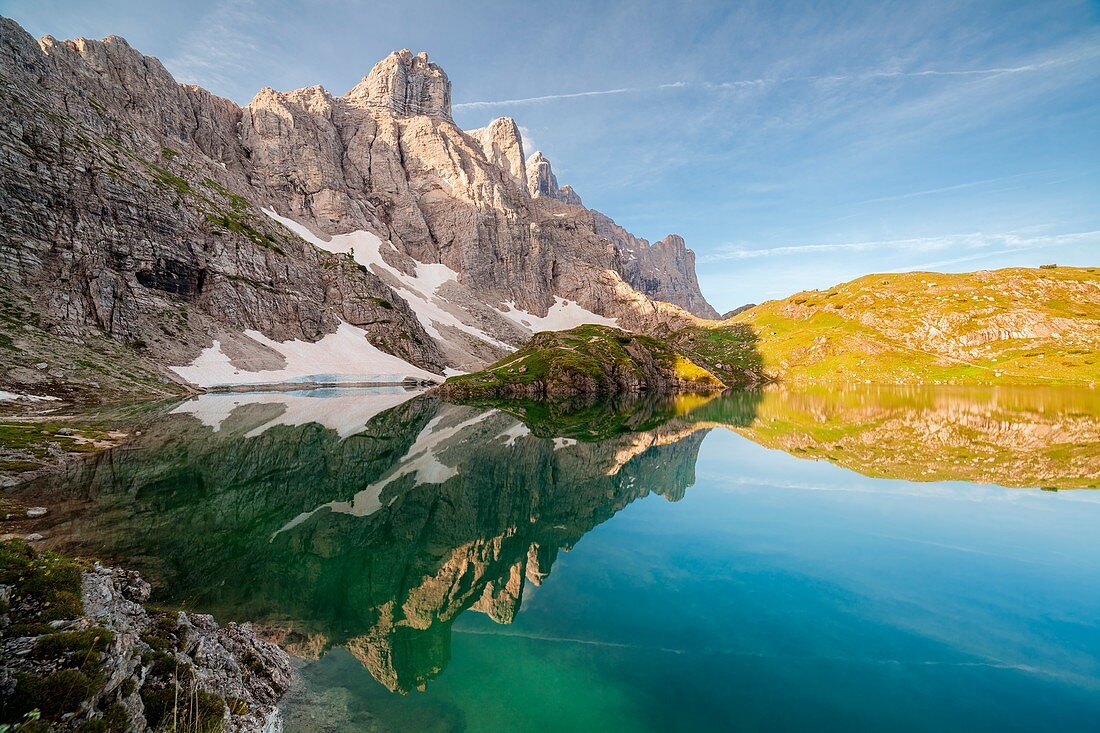 Europe, Italy, Veneto, Belluno, The towers of mount Civetta reflected in the Lake Coldai on a clear summer morning, Civetta group, Dolomites