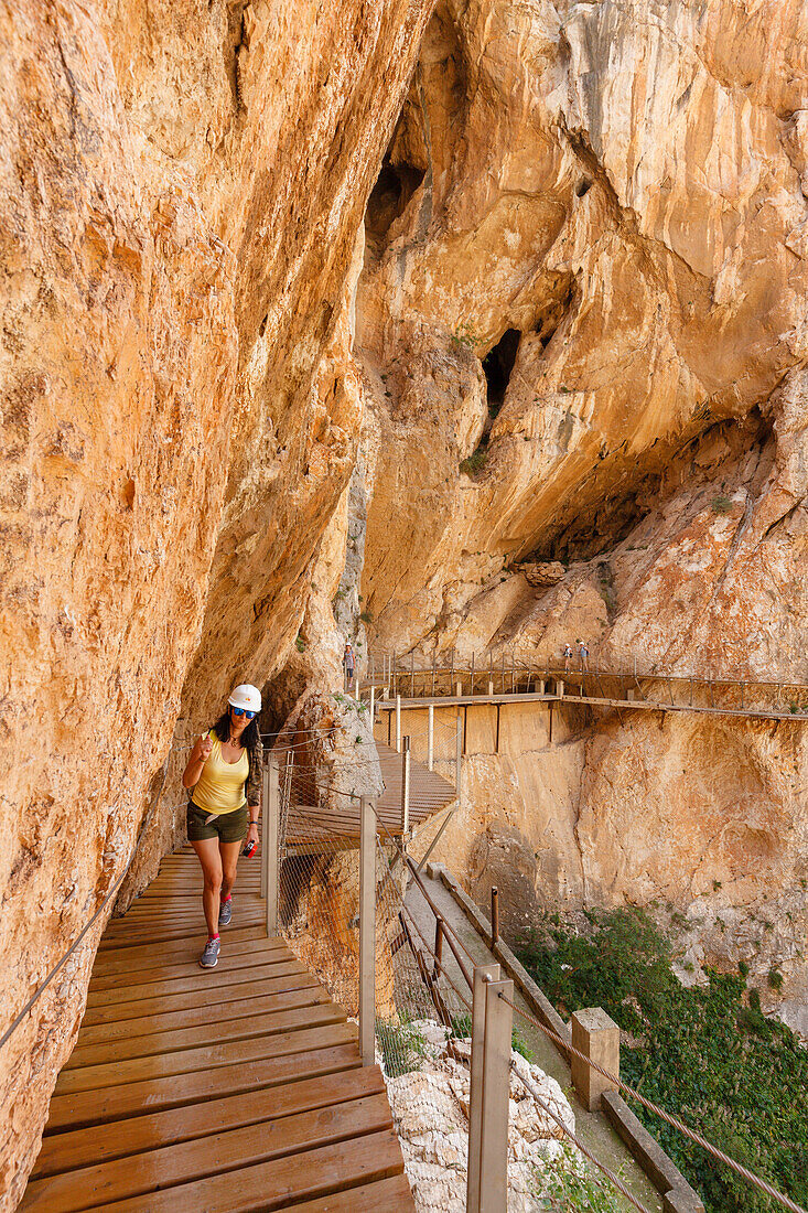 hiker on the Caminito del Rey, via ferrata, hiking trail, gorge, Rio Guadalhorce, river, Desfiladero de los Gaitanes, near Ardales, Malaga province, Andalucia, Spain, Europe