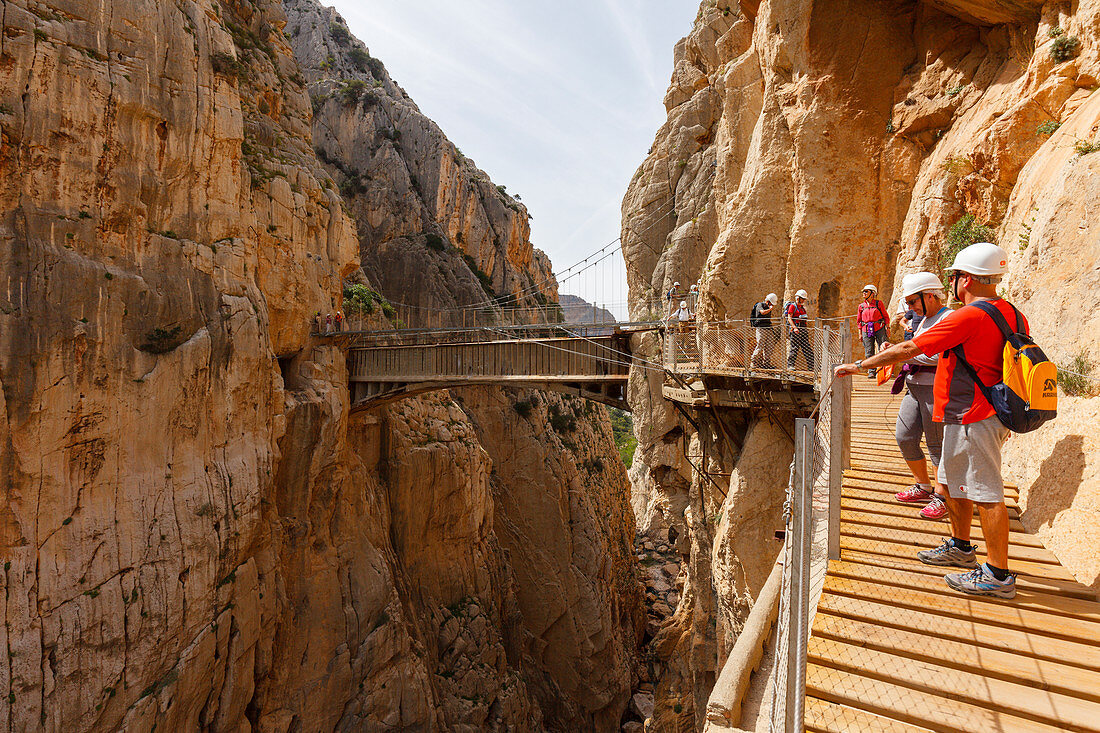 hikers and bridge at the Caminito del Rey, via ferrata, hiking trail, gorge, Rio Guadalhorce, river, Desfiladero de los Gaitanes, near Ardales, Malaga province, Andalucia, Spain, Europe