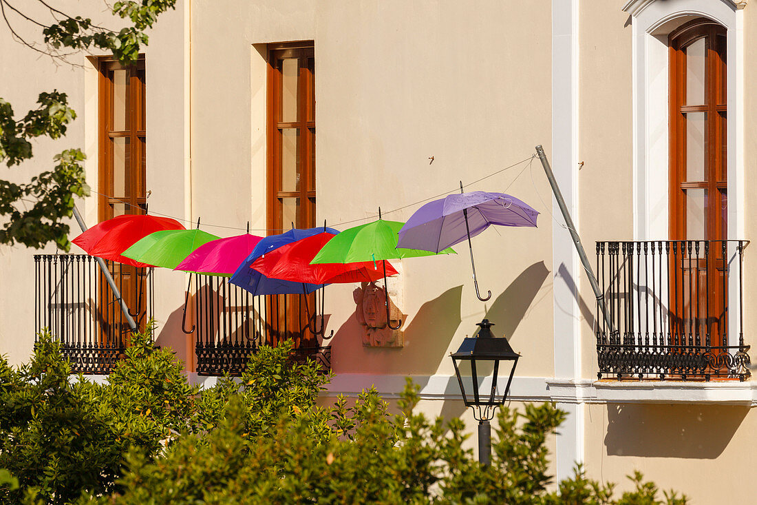 coloured umbrellas against a facade, Ayuntamiento, Town hall, Alhama de Granada, Granada province, Andalucia, Spain, Europe