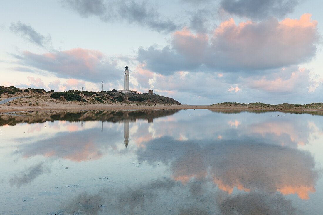 lighthouse, water reflection, Cabo de Trafalgar near Los Canos de Meca, near Vejer de la Frontera, Costa de la Luz, Atlantic Ocean, Cadiz province, Andalucia, Spain, Europe