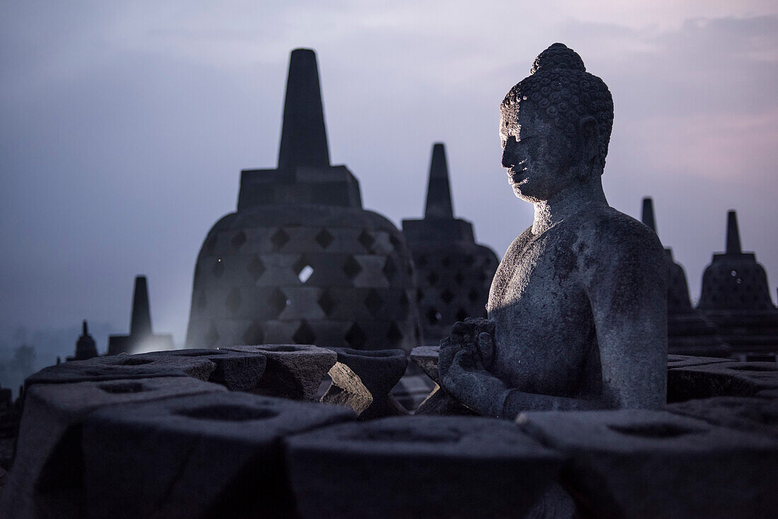 Buddha Statue At The Borobudur Temple In Java, Indonesia