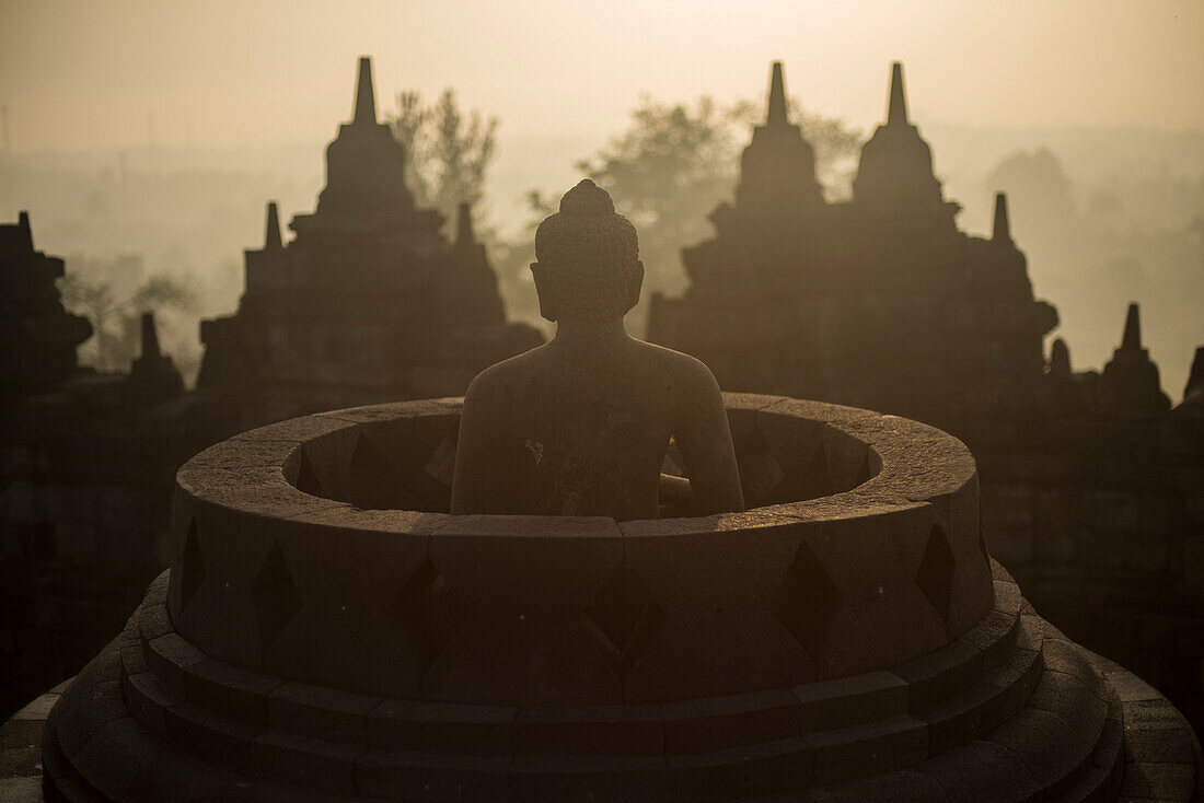 Buddha Statue At The Borobudur Temple In Java, Indonesia