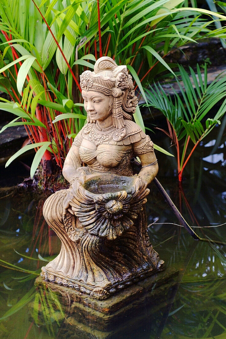 Thai Statue Of A Female Goddess In A Garden Pond, Nong Nooch, Thailand