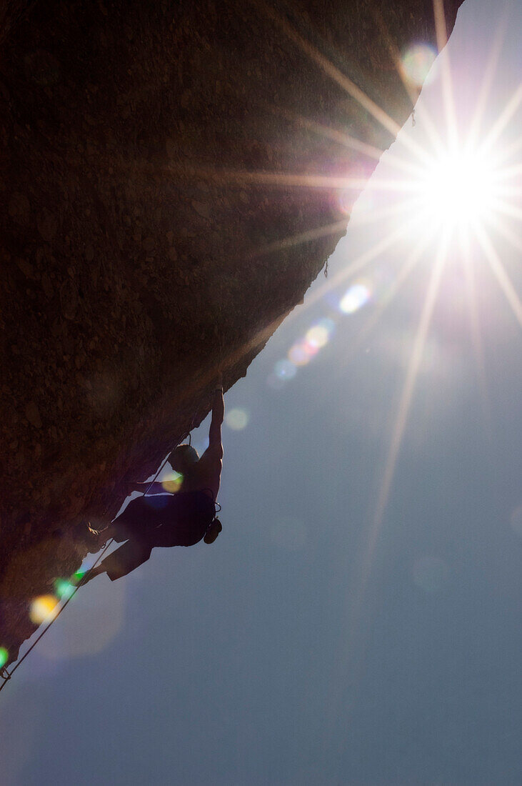 Man Rock Climbing On Rock