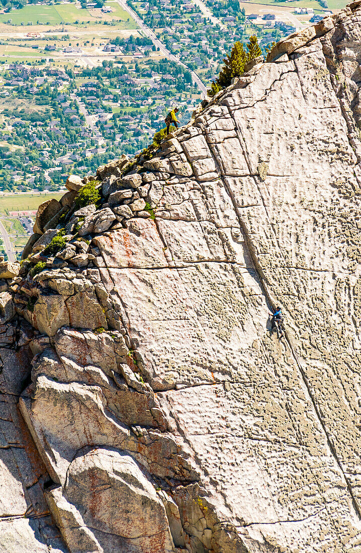 A Group Of Friends Work There Way To The Top Of The Climbing Route On Lone Peak Located In Utah's Wasatch Mountains