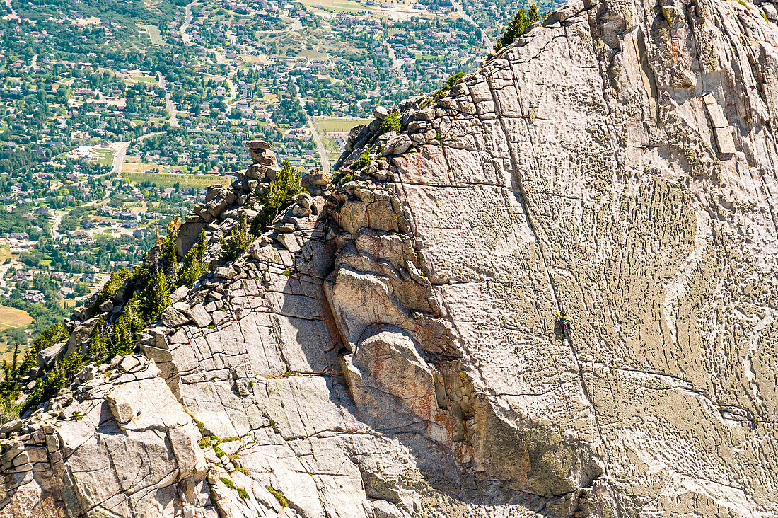 A Group Of Friends Work There Way To The Top Of The Climbing Route On Lone Peak Located In Utah's Wasatch Mountains