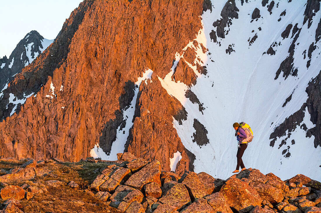 A Woman With Her Backpack Hiking On Blaine Peak Below Mount Sneffels