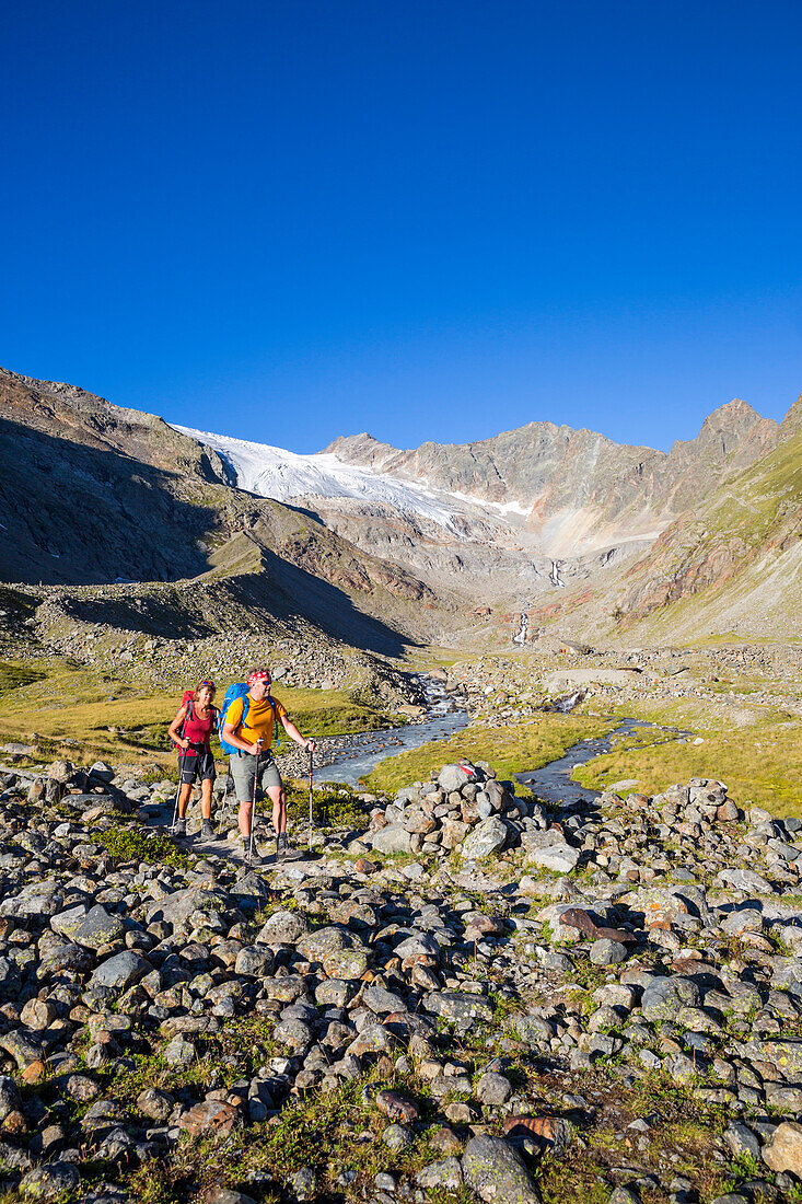 A man and a woman hiking, Sulzenautal and Sulzenau Glacier, Stubai Valley Trail, Stubaital, Tyrol, Austria, Europe