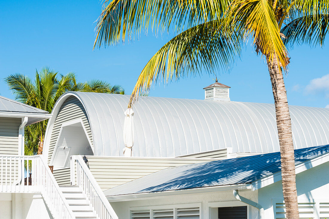 The boat house of a noble villa framed by palm trees, Boca Grande, Florida, USA