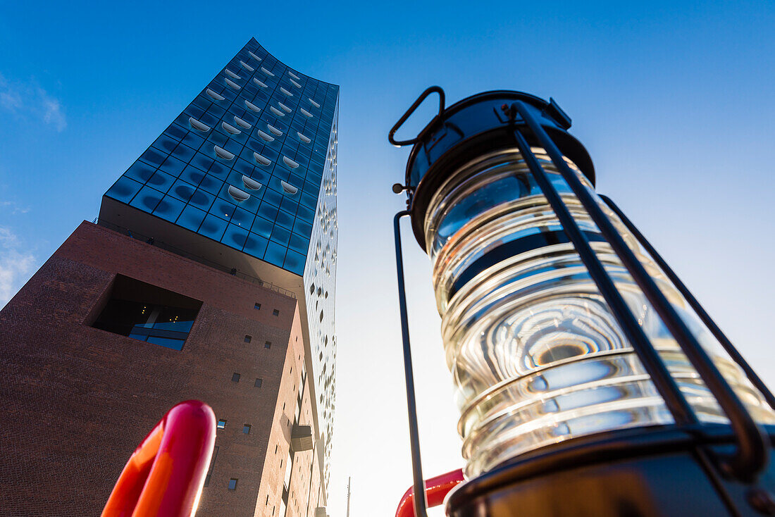 A navigation light in front of the Elbphilharmonie from a low-angle view, Hamburg, Germany
