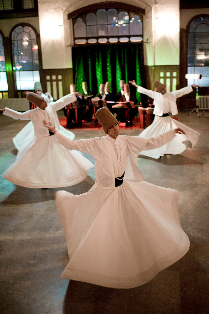 Istanbul, Turkey - January, 2008: The brotherhood of followers of Rumi known as Mevlevi or Whirling Dervishes perform their distinctive religious ceremony in Istanbul, Turkey. Rumi is famous for his poetry and religious writing and lived in the 13th centu