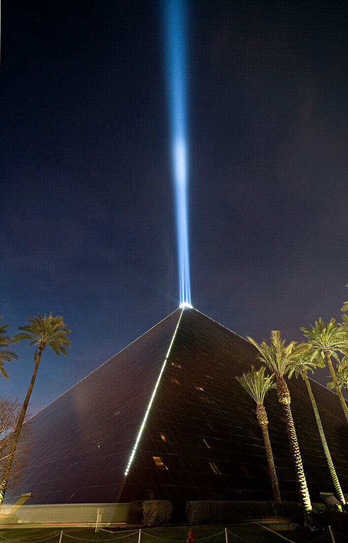 The Luxor Hotel and Casino at night with the famous Luxor light shining into the night sky, Las Vegas, Nevada, USA.