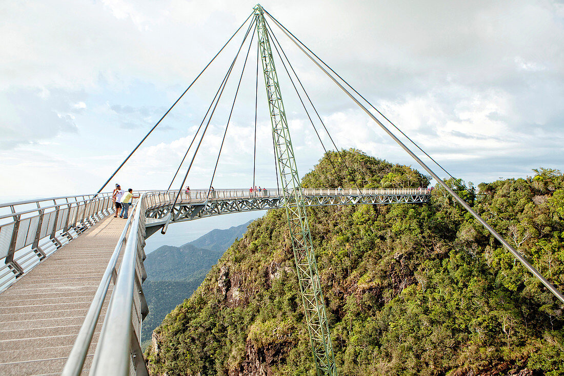 Langkawi cable car is the steepest cable car ride on earth and takes visitors up 708m above sea level to the curved pedestrian sky bridge is built atop Langkawi's second highest peak of Mt. Machinchang.  Langkawi, officially known as Langkawi the Jewel of