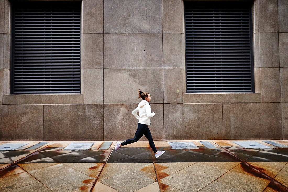 Woman Running On The Street Of Boston