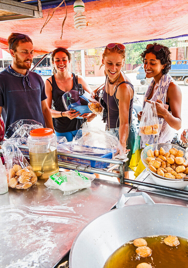 Group Of Happy Friends At Street Food Stall