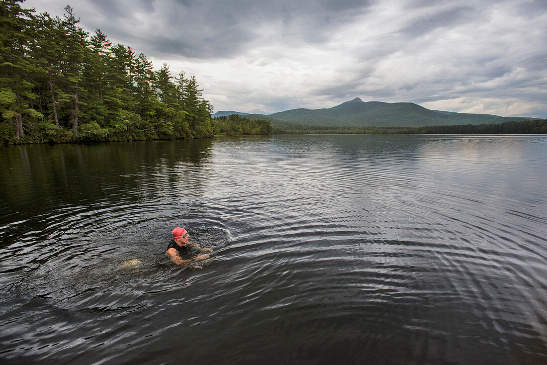 A Swimmer Taking A Break In The Shallow Water On A Cloudy Day