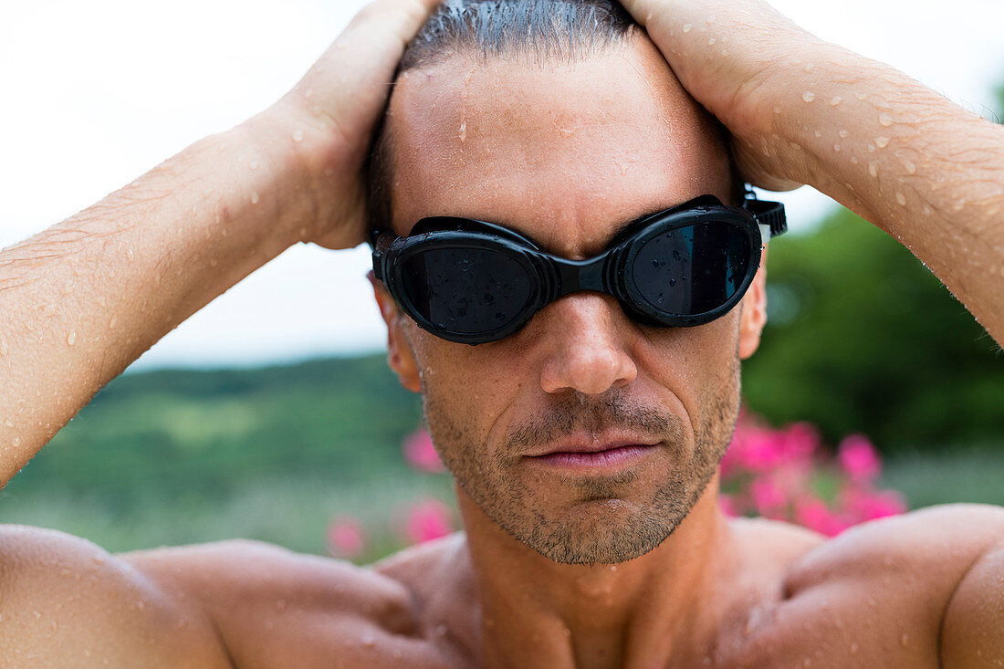 Portrait Of A Man Wearing Sunglasses With Wet Hair