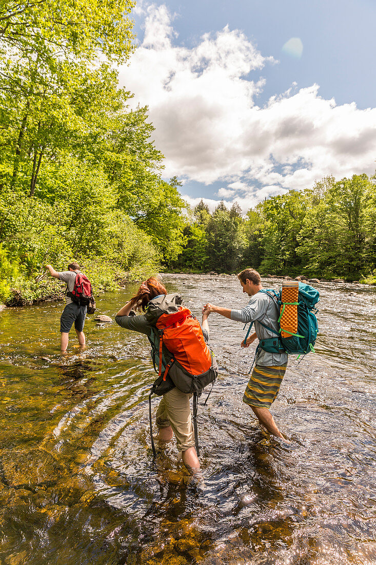 Hikers Ford The Pleasant River While Hiking On The Appalachian Trail