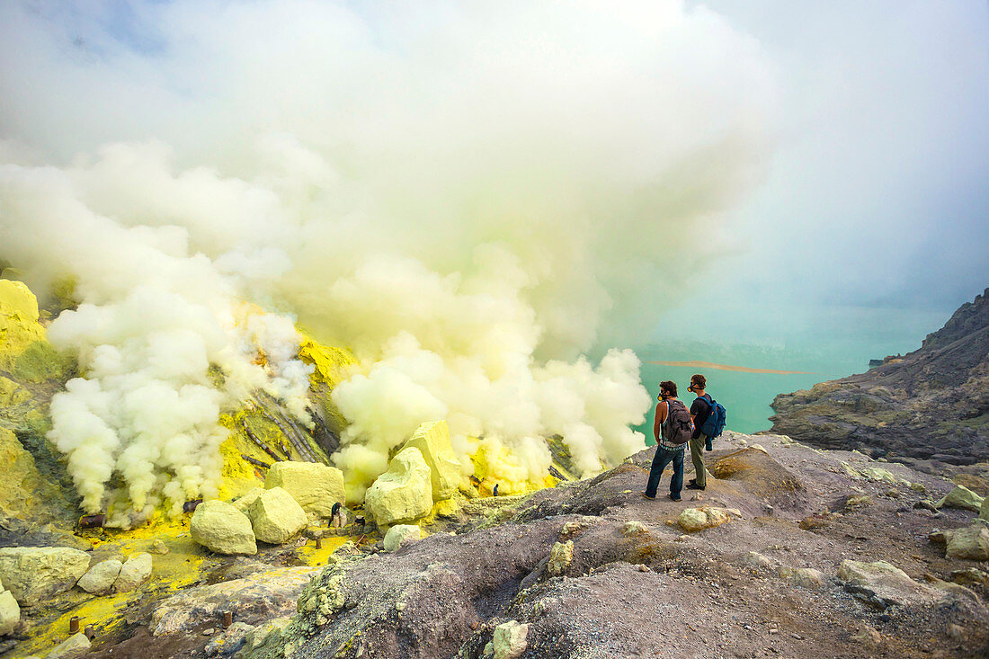 Two Male Hikers In Volcano Kawah Ijen, Java, Indonesia