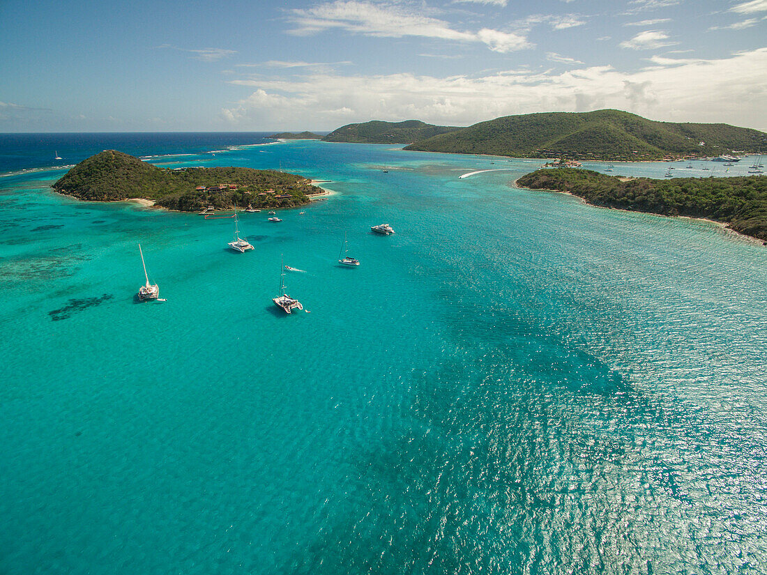 Sailboats Rest In The Clear Waters Near Prickly Pear Island In The British Virgin Islands