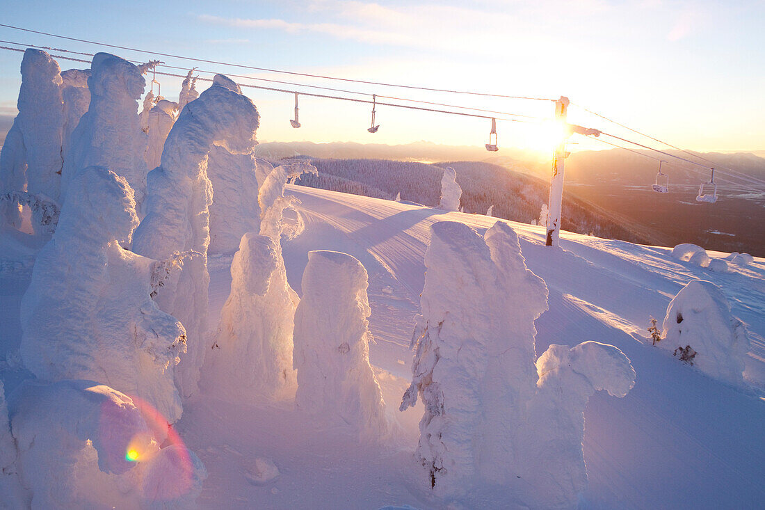 Snowghost And Chair Lift Above The Swan Mountain Range In Whitefish, Montana, Usa