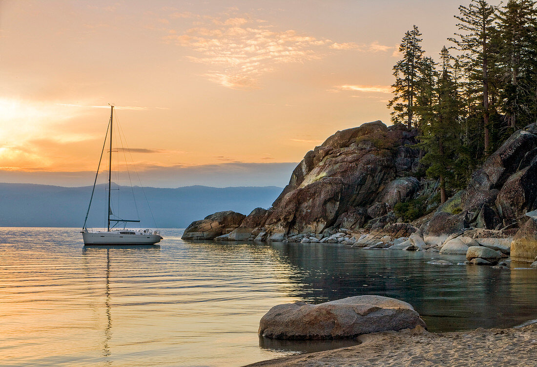 Sail Boat Over The Lake Tahoe During Sunrise