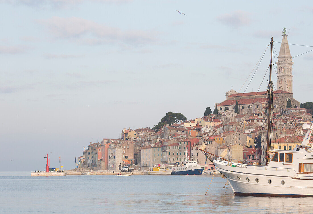 View across harbour to old town of Rovinj at sunset