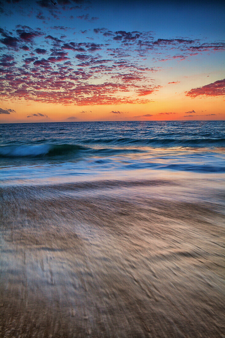 A Long Exposure Of Waves At Sunset On Mexico's Pacific Coast Near Todos Santos, Baja Sur