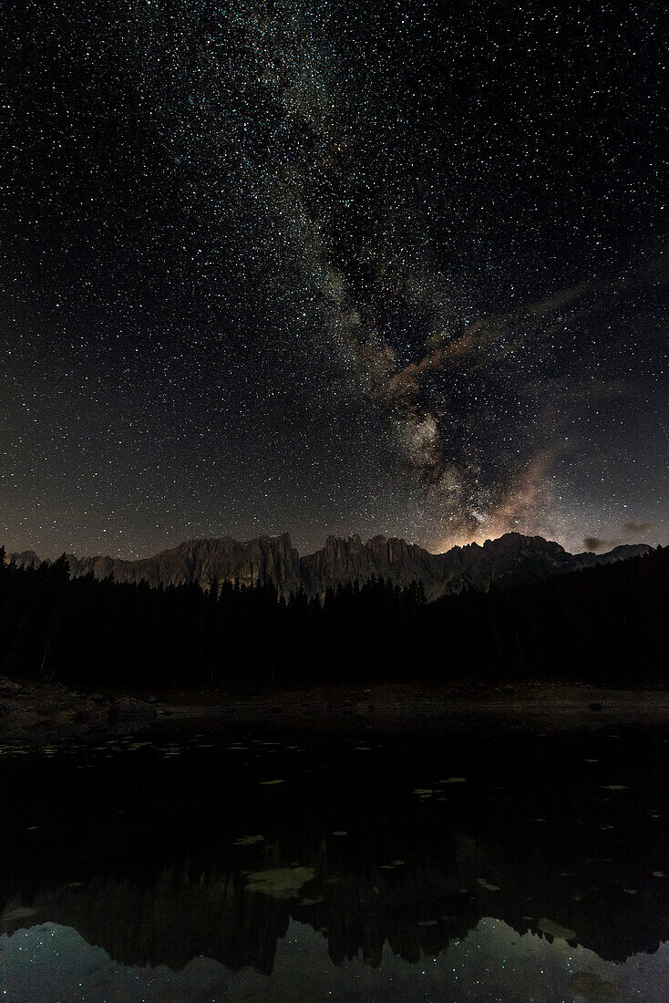 Europe, Italy, Trentino South Tyrol, Bolzano province, Milky way at carezza lake