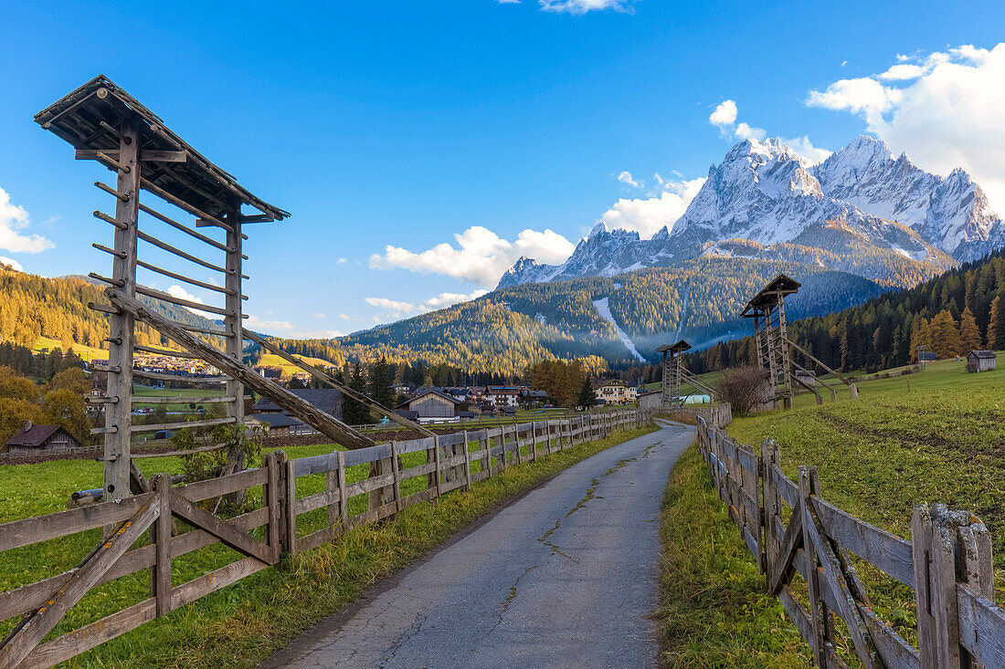 Europe, Italy, South Tyrol, Bolzano,  Drying racks for hay in the countryside of Sexten valley, Dolomites