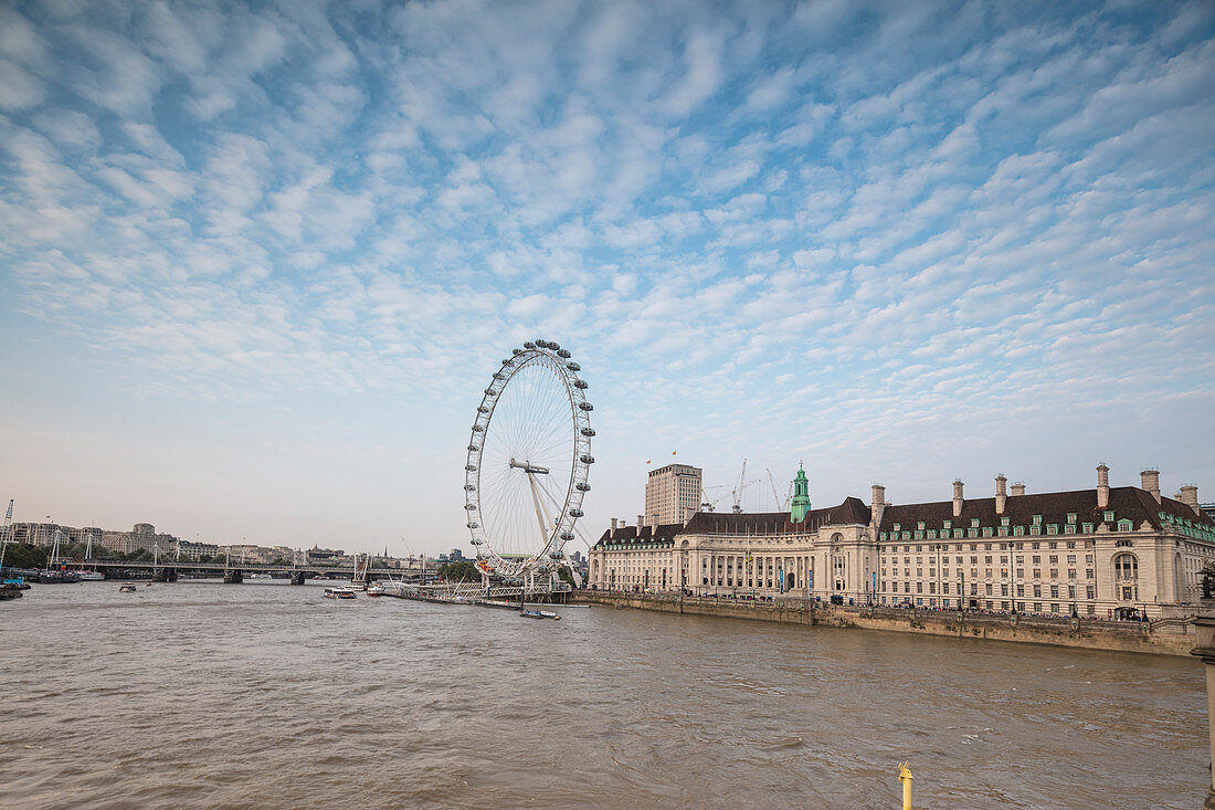River thames frames the London Eye the ferris wheel symbol of the city South Bank London United Kingdom