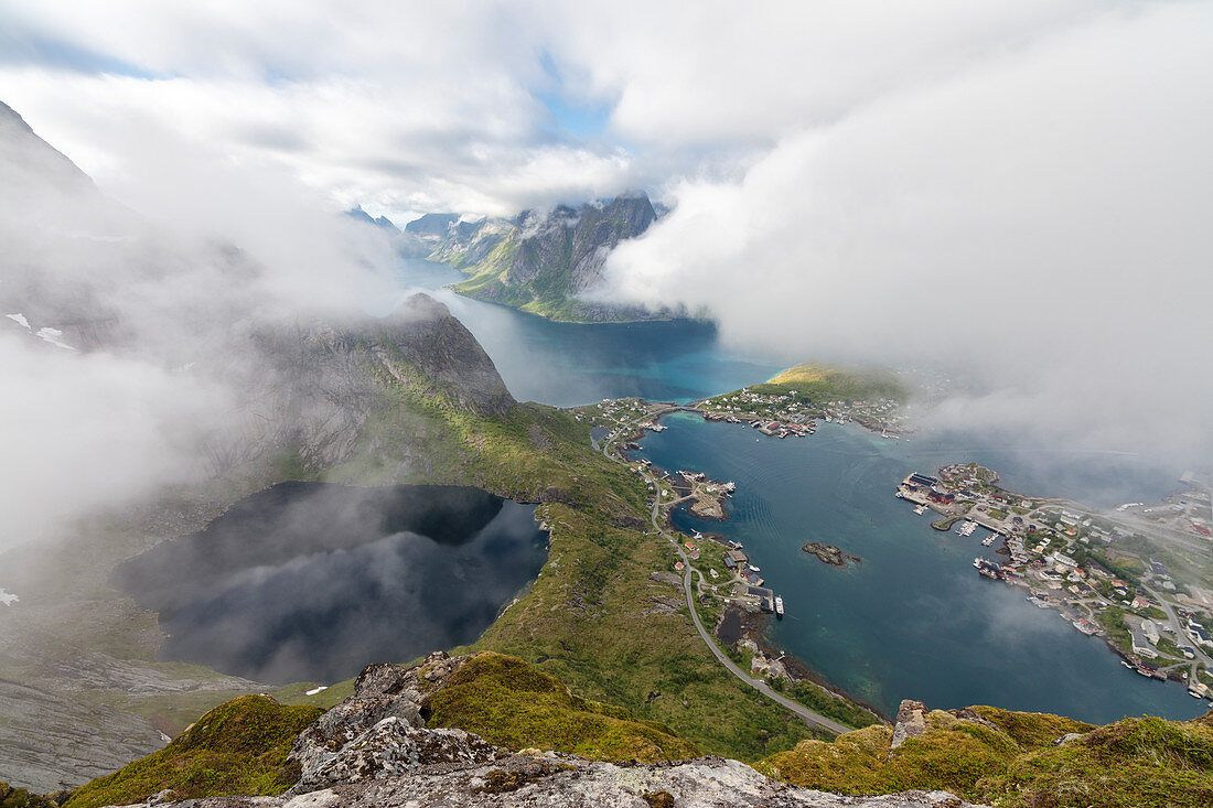 Top view of lakes and sea under the cloudy sky at summer Reinebringen Moskenes Lofoten Islands Norway Europe